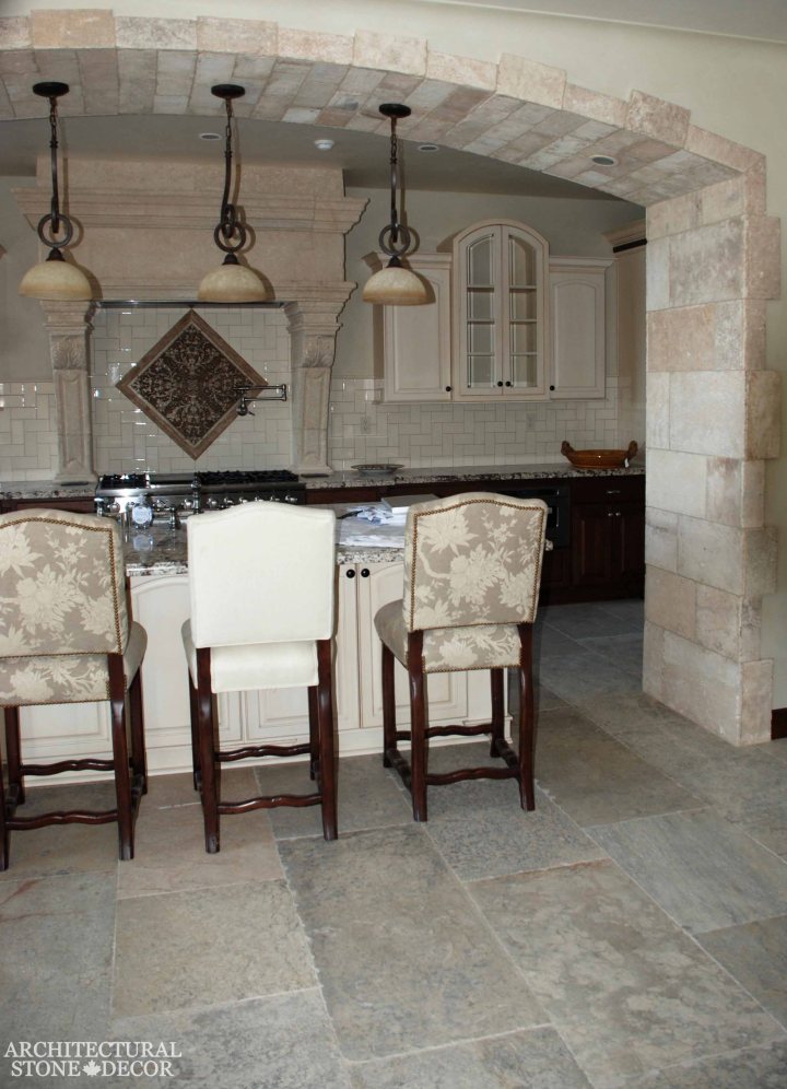 Game of Thrones medieval gothic style kitchen reclaimed hand carved limestone 'Barre Blonde' flooring 'Barre Blonde' wall cladding kitchen hood arch and corners